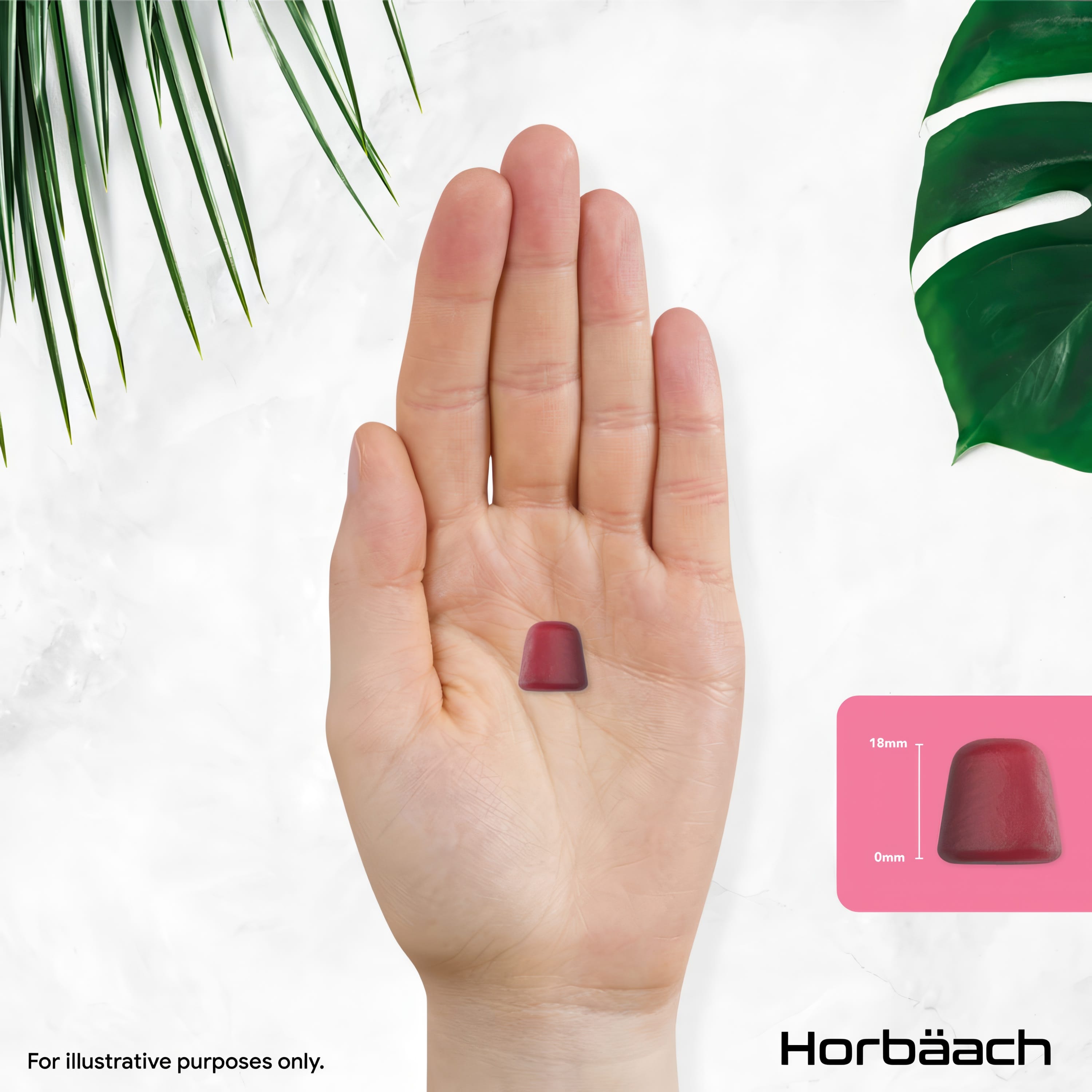 A red gummy, 18mm tall, rests on an open palm.