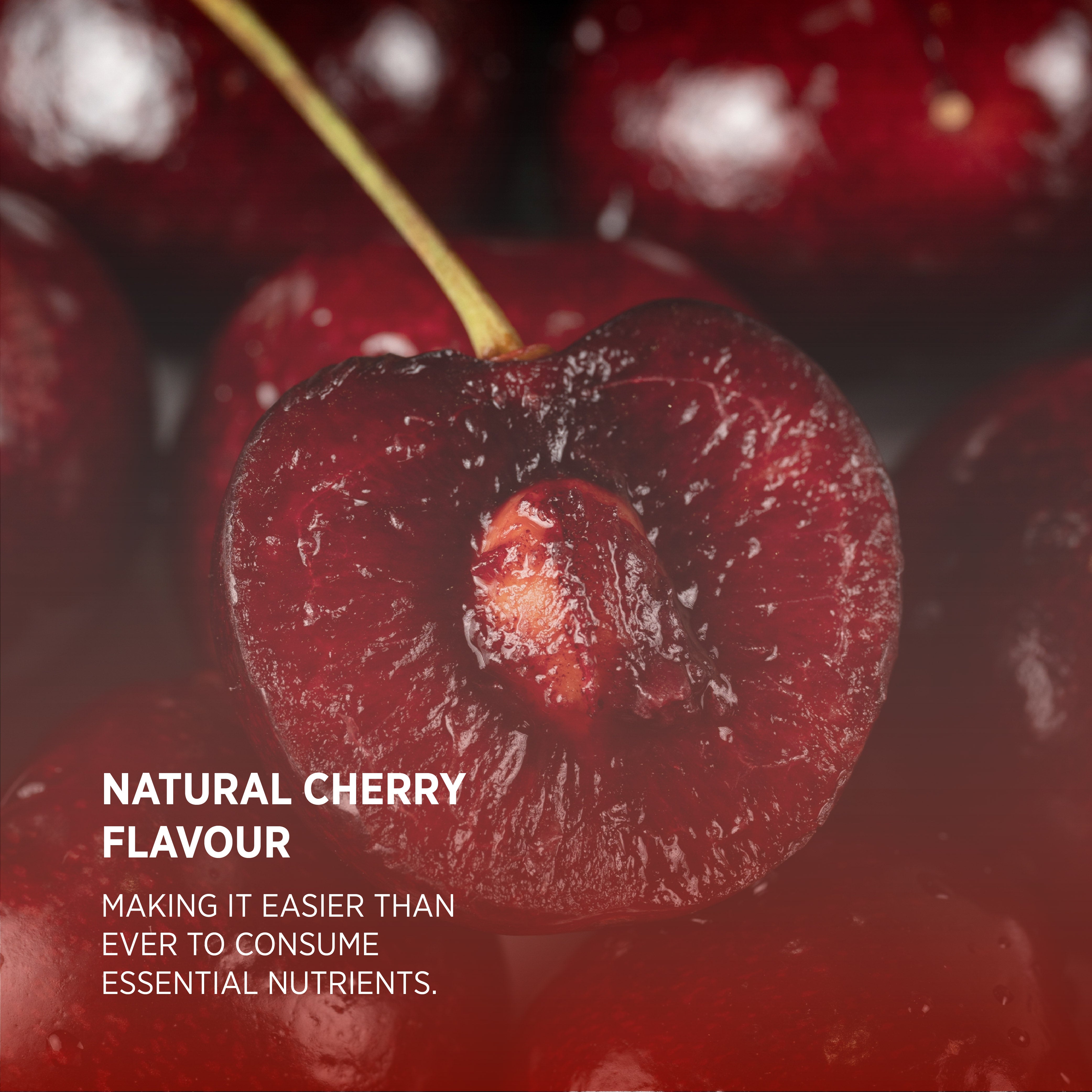 Cherry cut open with pit, stem, and text 'NATURAL CHERRY FLAVOUR MAKING IT EASIER TO CONSUME ESSENTIAL NUTRIENTS.'