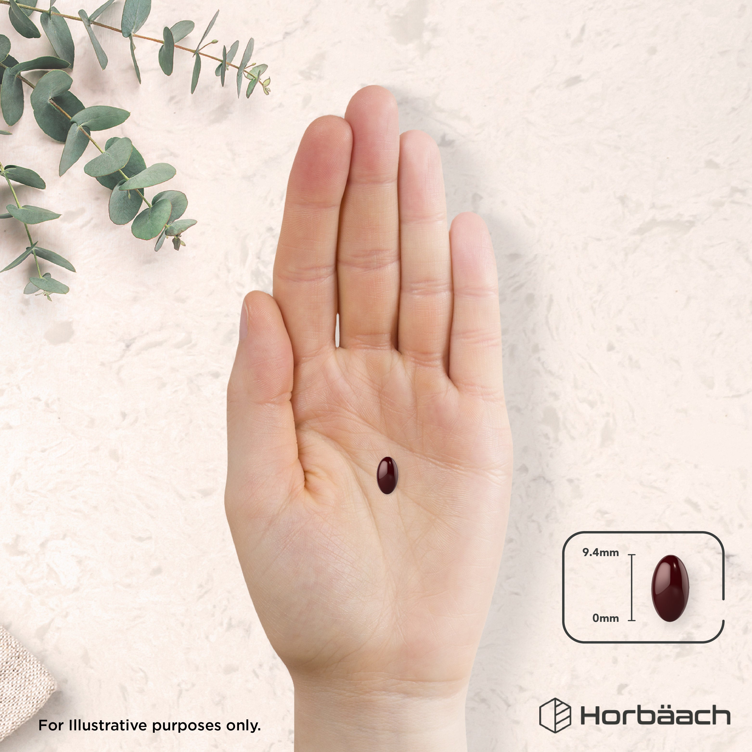 A single dark red Astaxanthin 18mg softgel, 9.4mm long, placed on a hand.