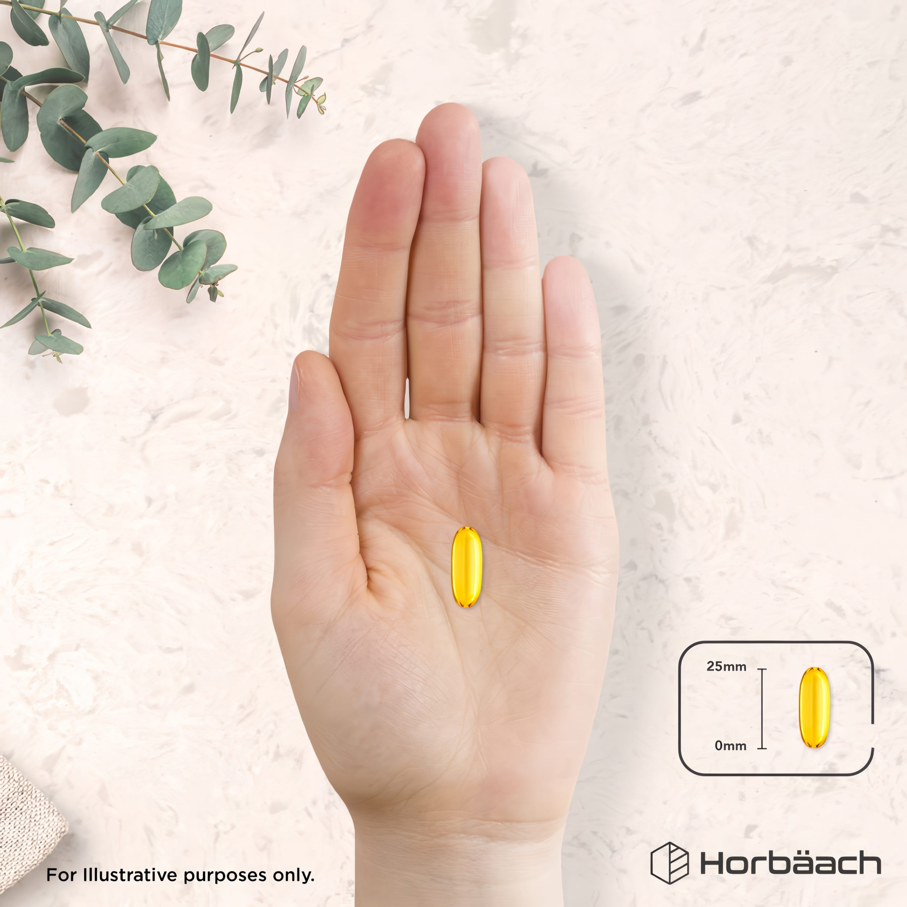 A yellow softgel displayed in a hand with a diagram showing its 25mm length.
