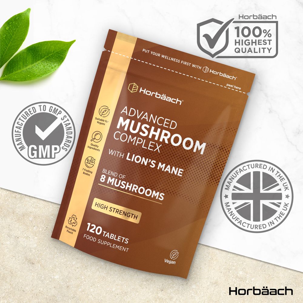 Horbäach Advanced Mushroom Complex pouch containing 120 tablets shown on a hand for scale.