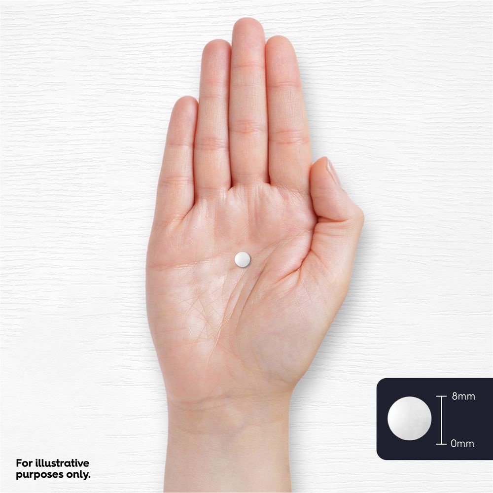 A white, round tablet shown on a hand scale, 8mm in diameter and 0mm in height.