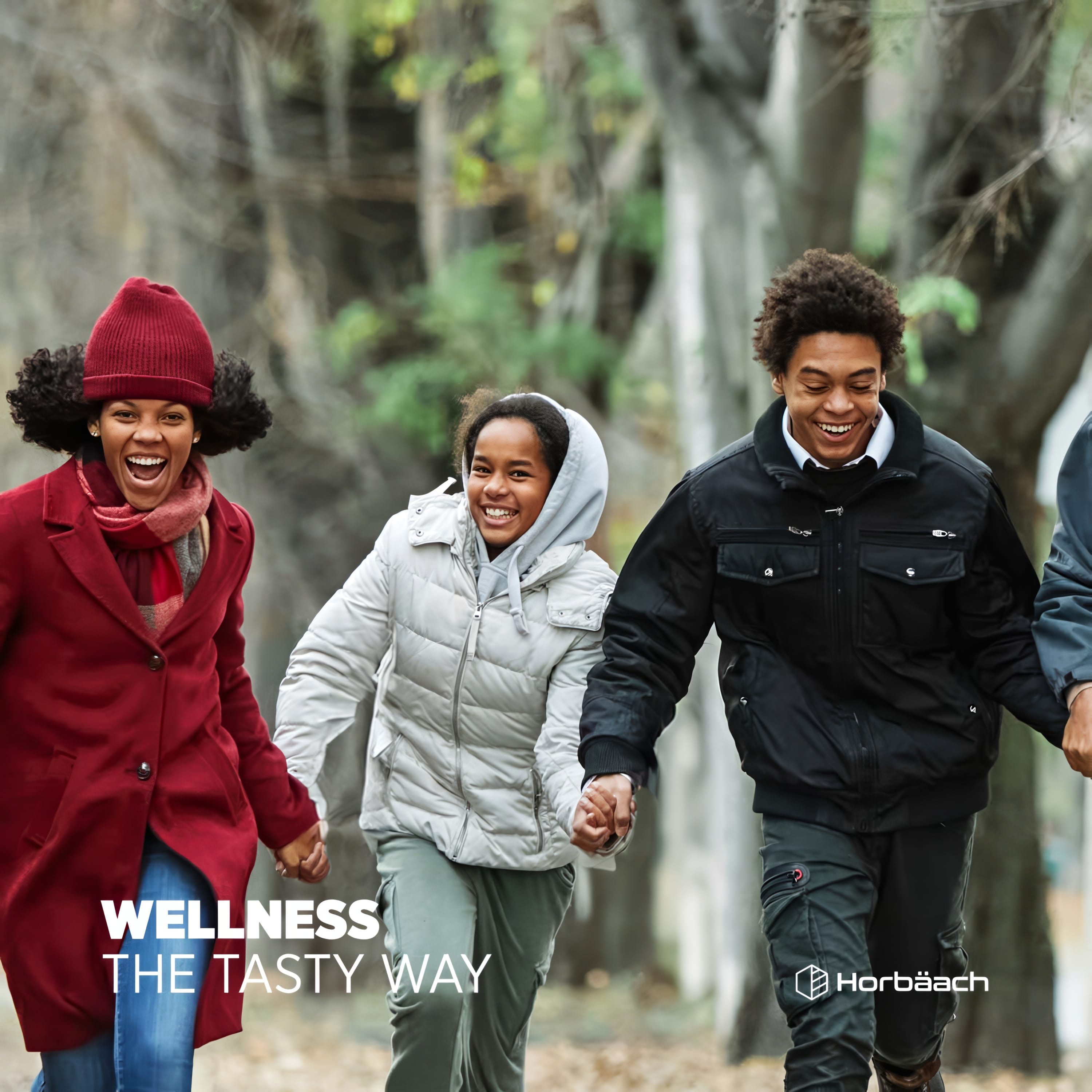 A smiling woman, teenage girl, and young man walk outdoors holding hands, promoting HU Biotic Teens Gummies.
