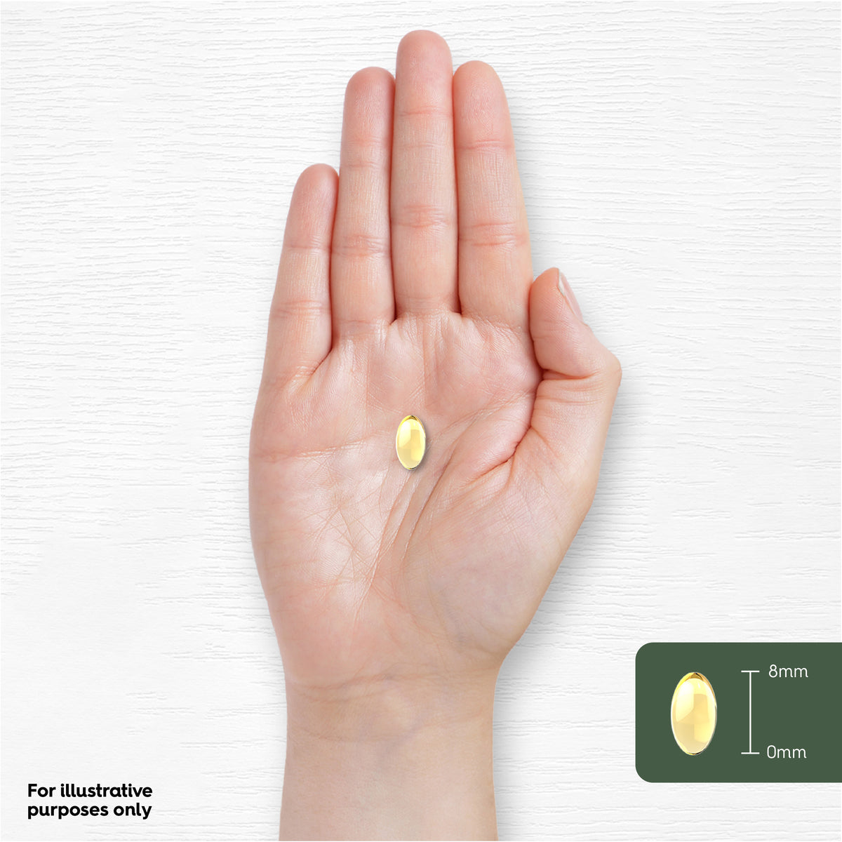 A softgel about 8mm in length, described as Garlic Pearl, resting on a hand for scale comparison.