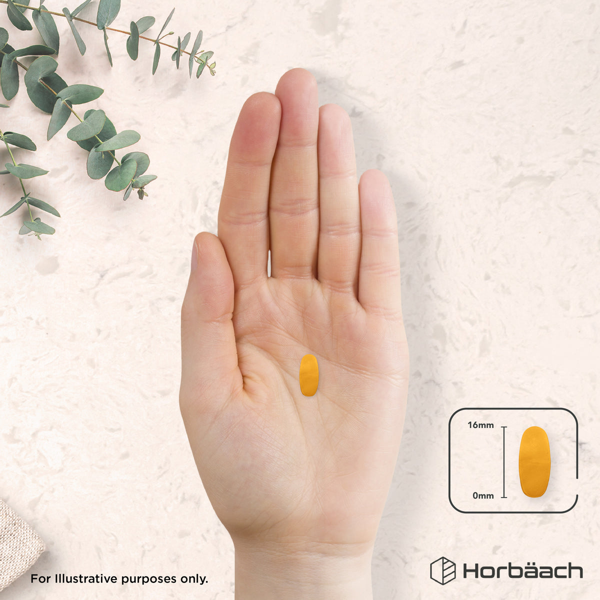 A single yellow oval tablet, measuring 16mm in length, is held in a hand.